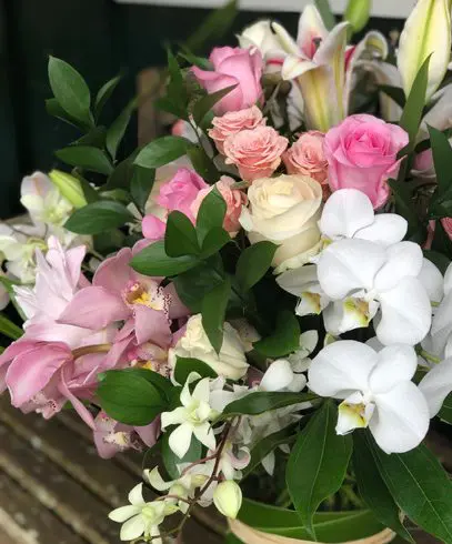 A bouquet of flowers is sitting on the table.