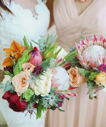 A close up of two bouquets with flowers