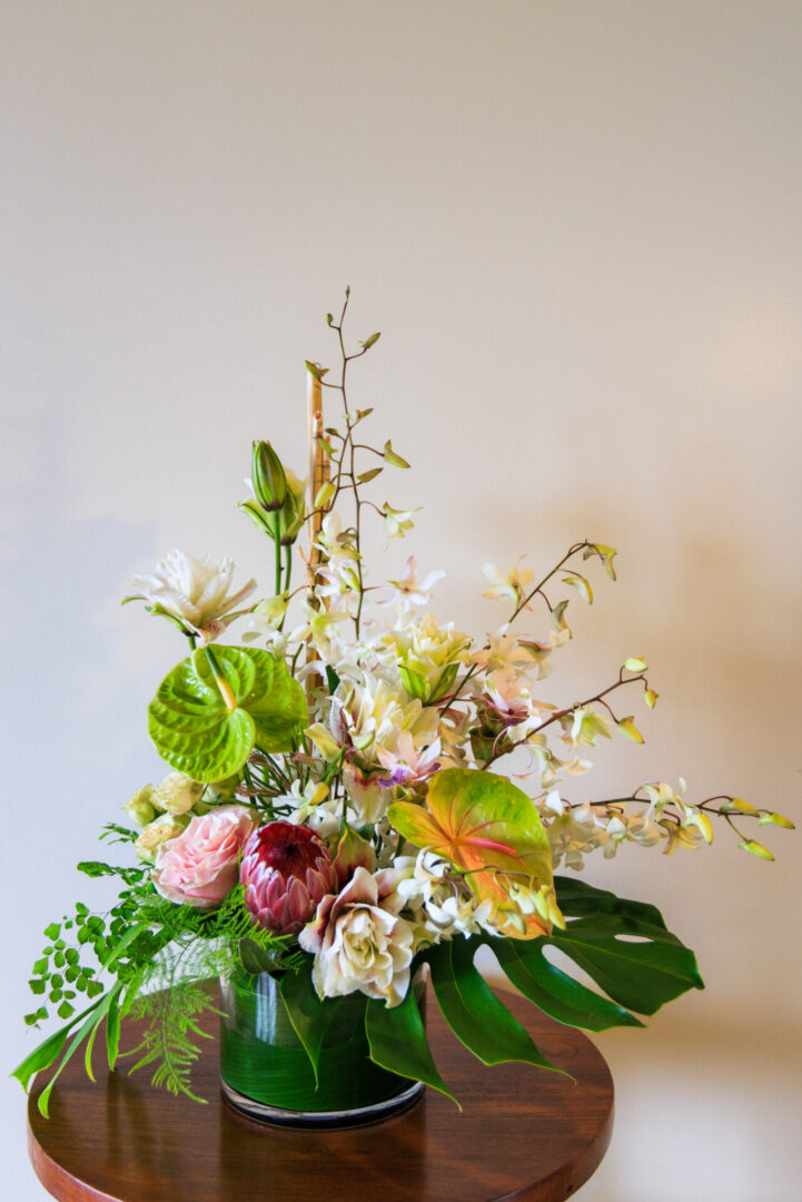 A bouquet of flowers in a vase on the table.