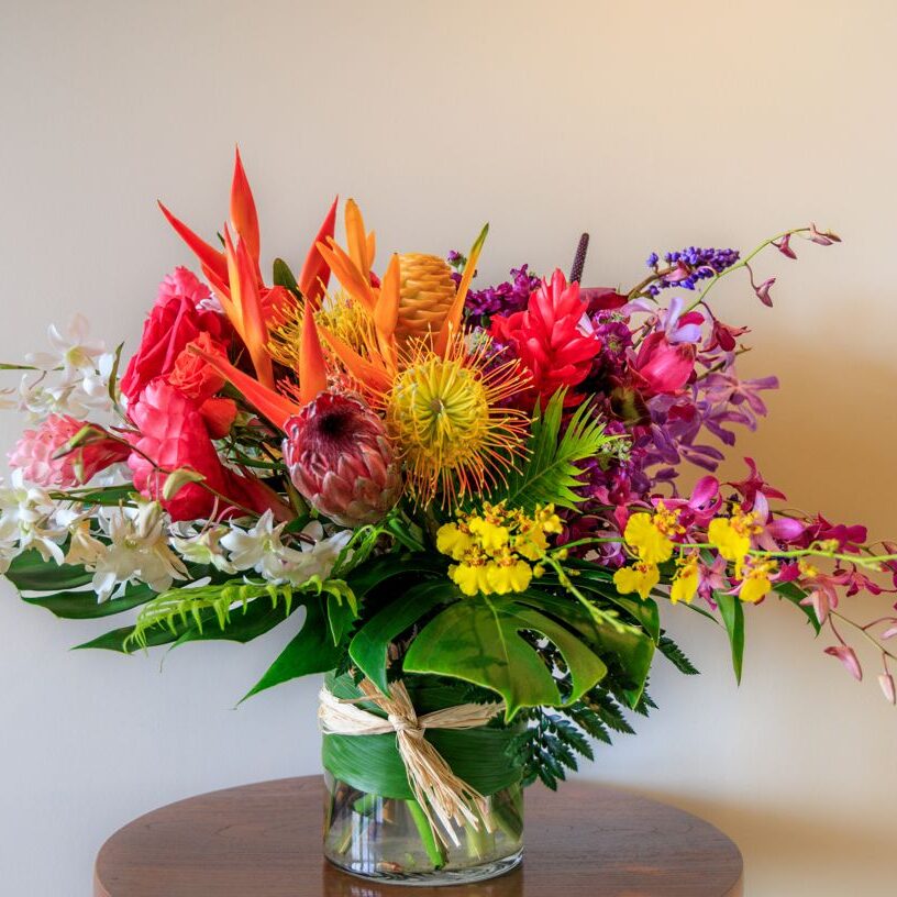 A vase filled with flowers on top of a table.